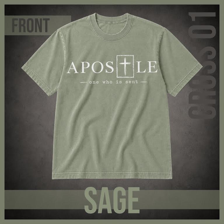 A sage green short-sleeve t-shirt with a white graphic print reading 'APOSTLE' and 'one who is sent' with a cross symbol, displayed on a dark textured background with 'FRONT', 'SAGE', and 'CROSS 01' text overlays.