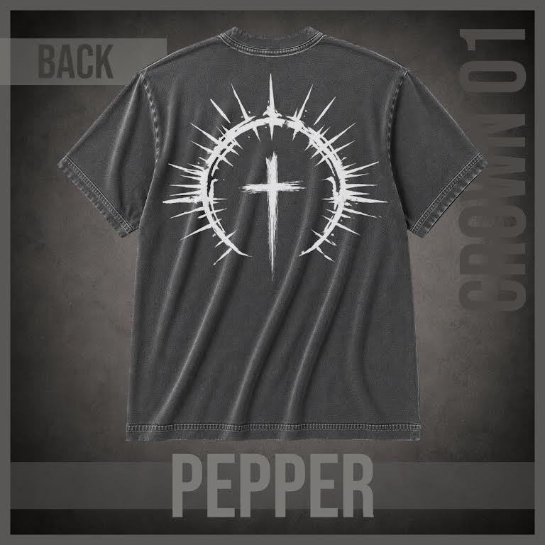 A dark gray washed t-shirt shown from the back, featuring a large white graphic of a cross inside a thorny circular halo. The shirt is presented on a textured dark gray background with 'BACK' in the top left, 'CROWN 01' on the right, and 'PEPPER' at the bottom.