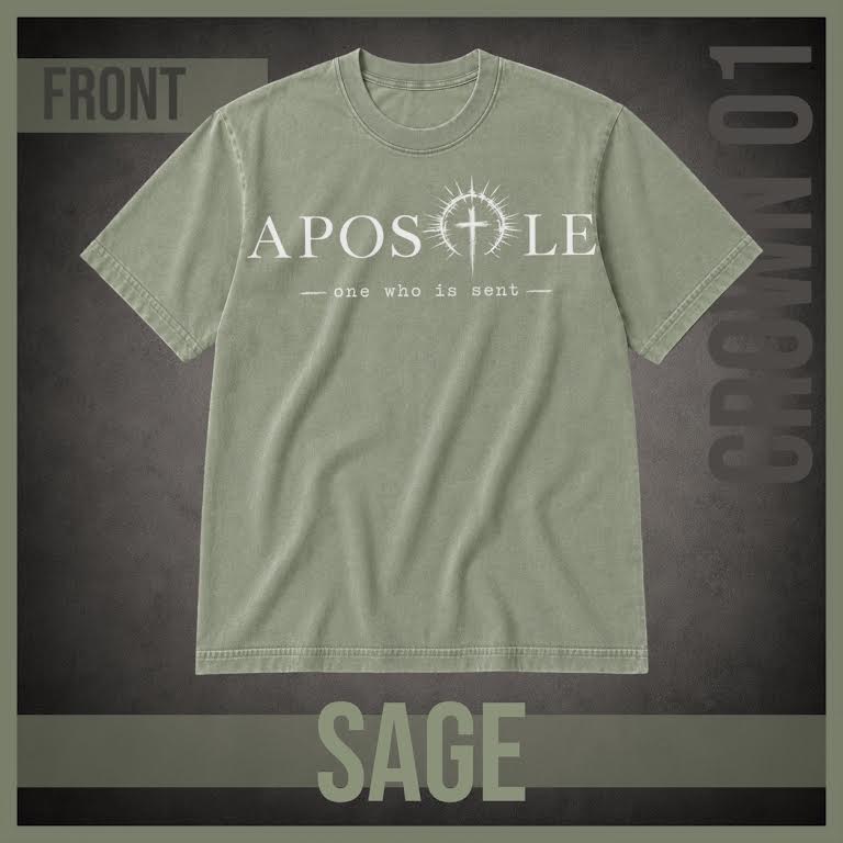 A sage green short-sleeve t-shirt with a white graphic print on the front reading 'APOSTLE' and 'one who is sent' with a cross symbol, displayed on a dark textured background with 'FRONT', 'SAGE', and 'CROWN 01' text overlays.